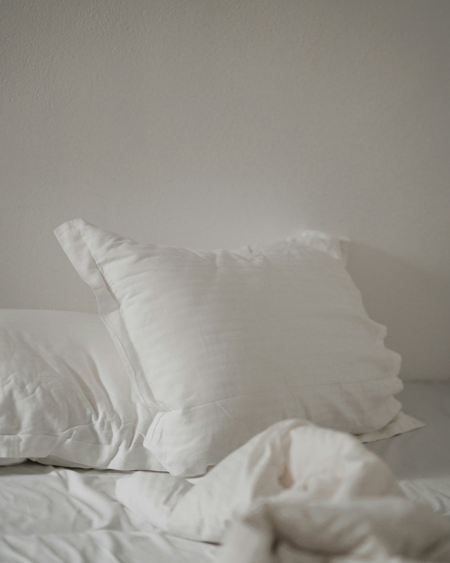 Close view of a white hotel pillow with a fine sateen stripe